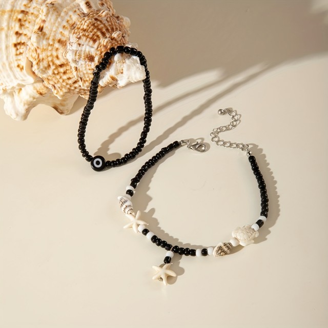 Komplet 2 zapestnic za nogo z morsko zvezdo, školjkami in modrim očesom