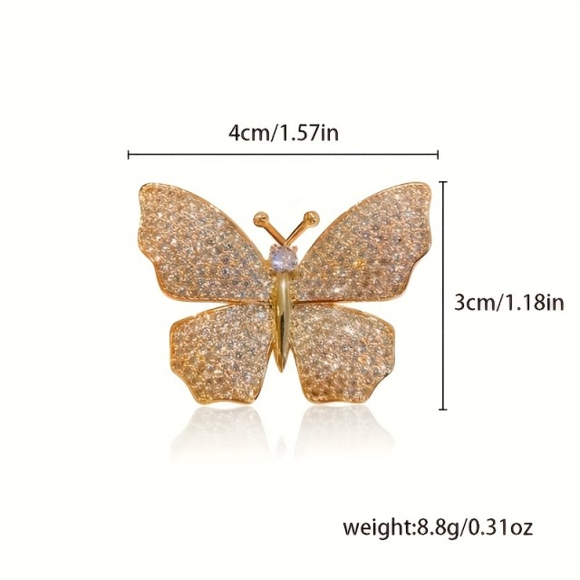 Elegantna broška z metuljem srebrne barve