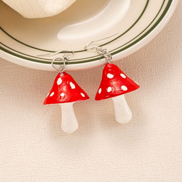 Prikupni uhani v obliki mušnic