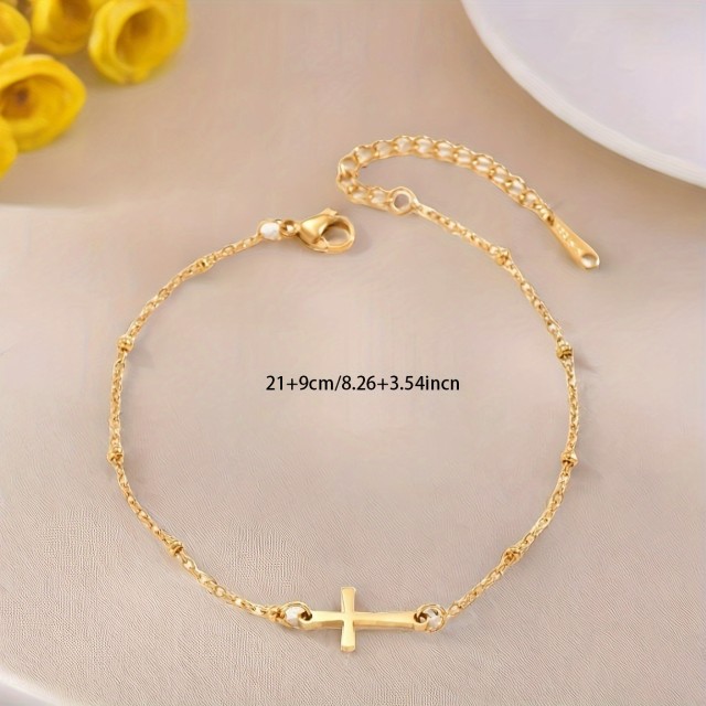 Zlata zapestnica za gleženj z obeskom križa