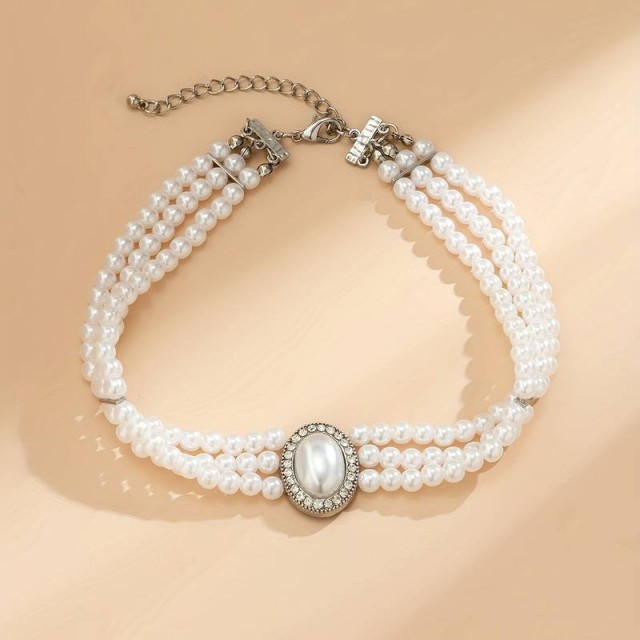 Večplastna ogrlica s perlami in umetnimi dragimi kamni
