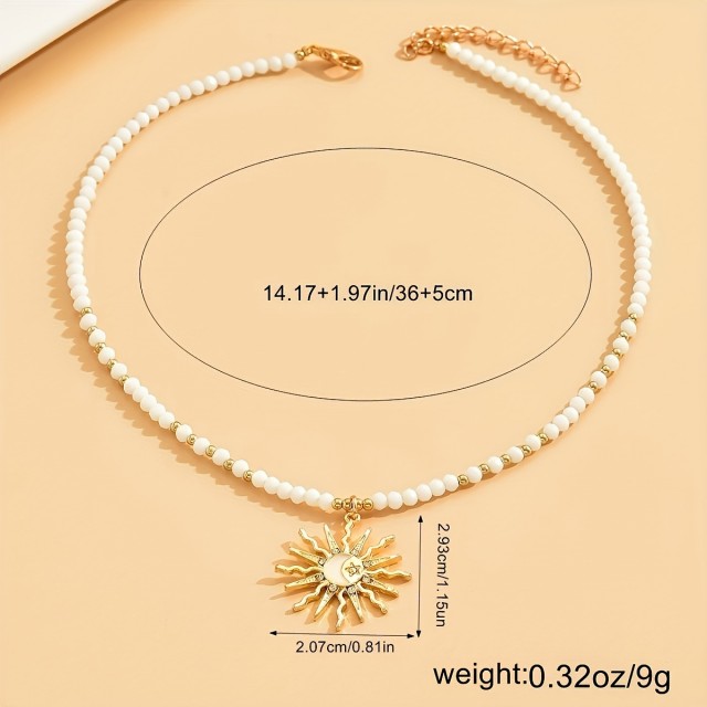 Elegantna poletna ogrlica z obeskom sonca v zlati barvi