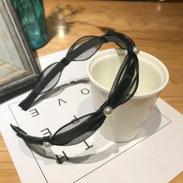 Eleganten okrasni naglavni trak z biserčki