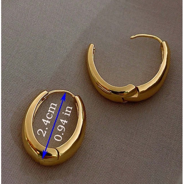 Elegantni zlati uhani v obliki debelejših obročkov