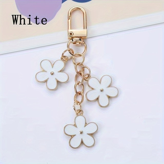 Kovinski cvetlični obesek za ključe bele barve