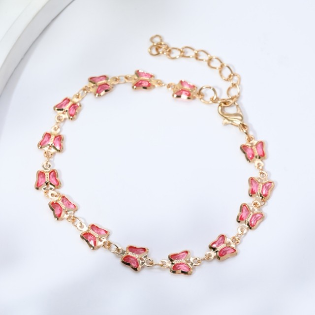 Čudovita zapestnica z roza kamenčki v obliki metulja