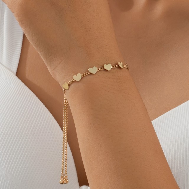 Nastavljiva ženska zapestnica s srci zlate barve