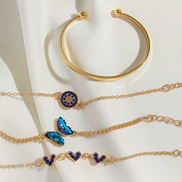 4 delni komplet zapestnic v zlatih odtenkih z modrimi dragulji 