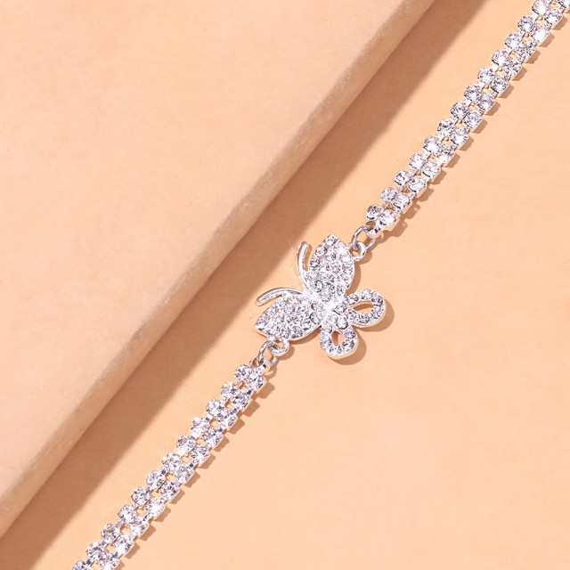 Elegantna zapestnica za nogo z metuljem srebrna