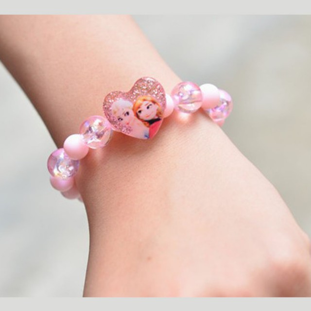 Prikupna roza zapestnica za deklice z Elzo in Ano