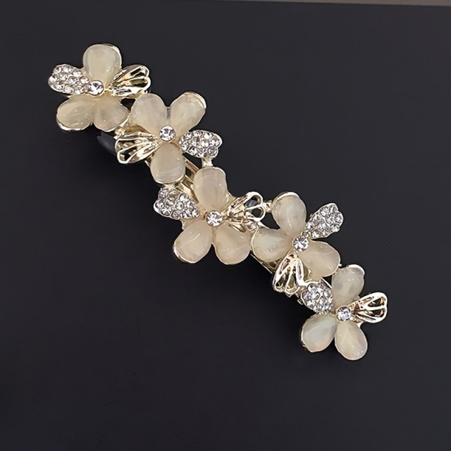 Okrasna sponka za lase s cvetličnim okrasjem