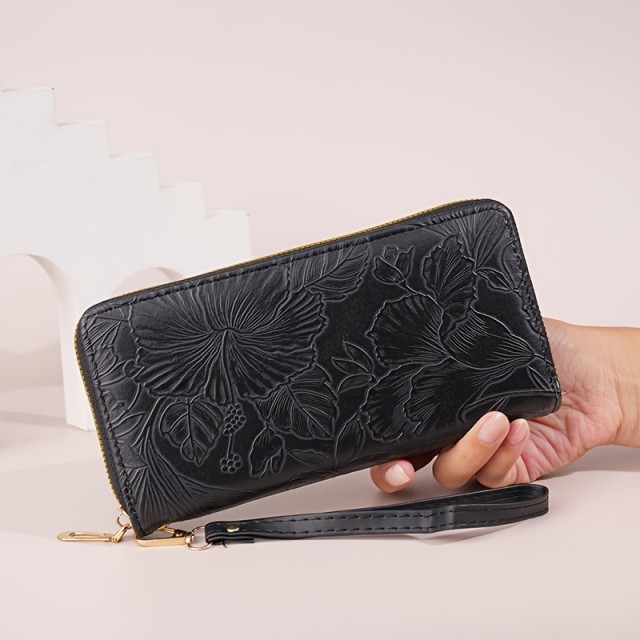 Ženska denarnica v črni barvi z reliefnim cvetličnim vzorcem