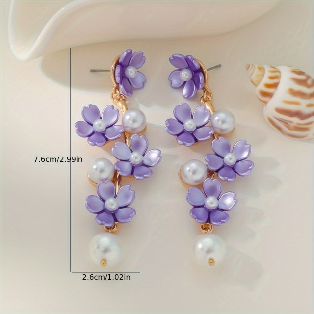 Čudoviti uhani v belo zlati barvi z rožicami 