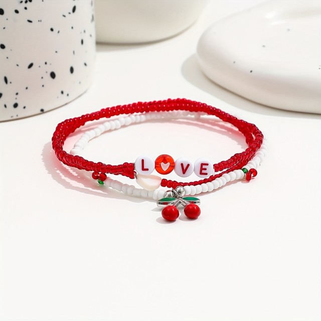 Komplet 3 zapestnic za nogo s češnjami in LOVE napisom