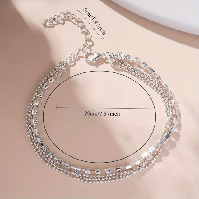 Večdelna zapestnica v srebrni barvi s cirkoni