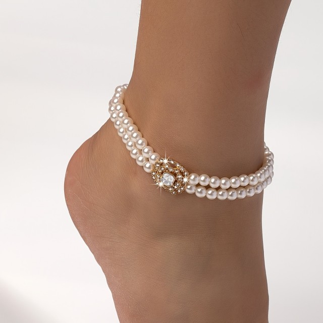Zapestnica za nogo s perlicami in zlatim dodatkom