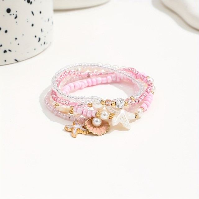 5 delni boho set zapestnic v roza barvi s školjkami