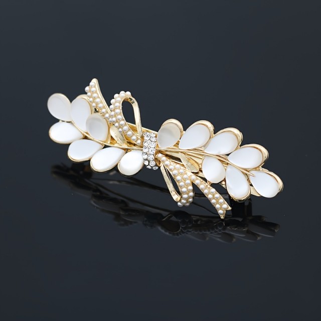 Elegantna sponka za lase v belo zlati kombinaciji