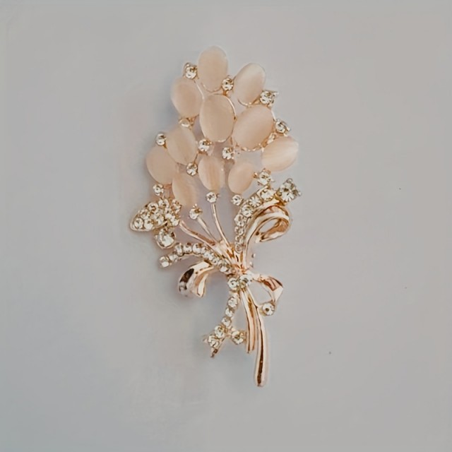 Elegantna cvetlična broška z okrasnimi kamni