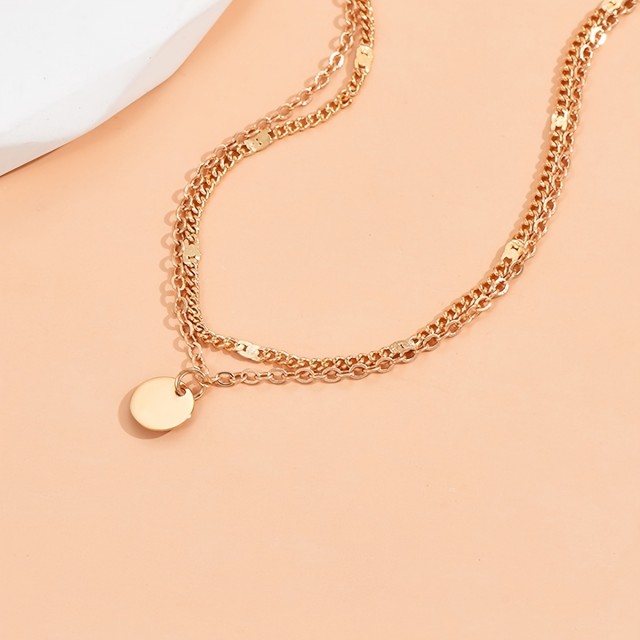 Dvojna zapestnica za nogo z obeskom krogca 2 barvi