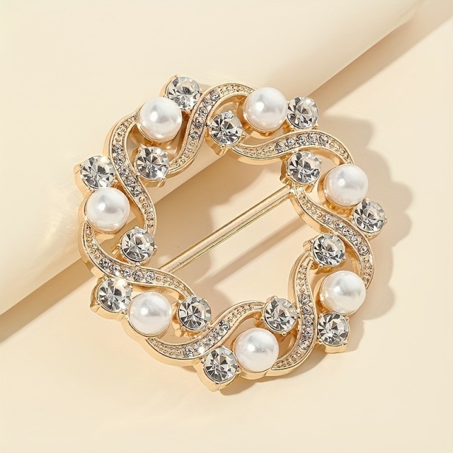 Elegantna broška z zlatimi cvetovi in kristali