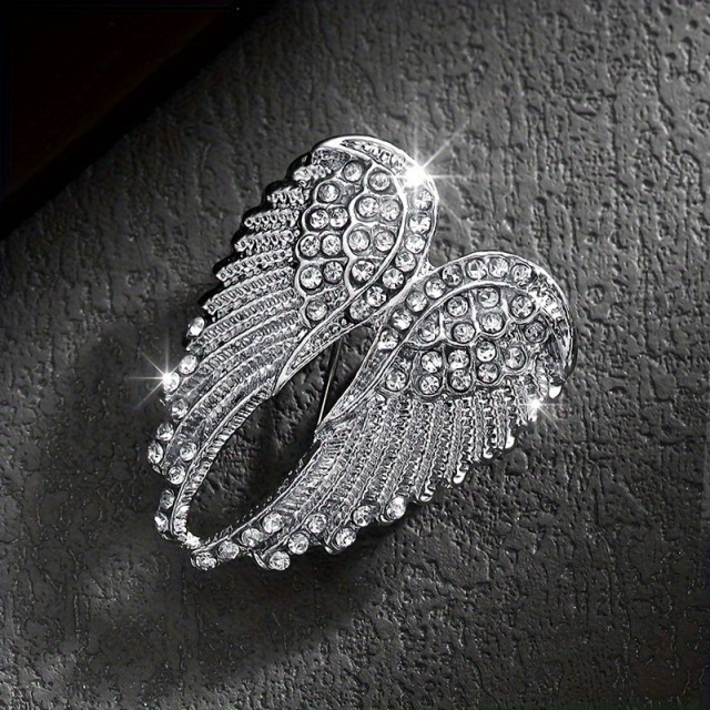 Elegantna broška z angelskimi krili v srebrni barvi