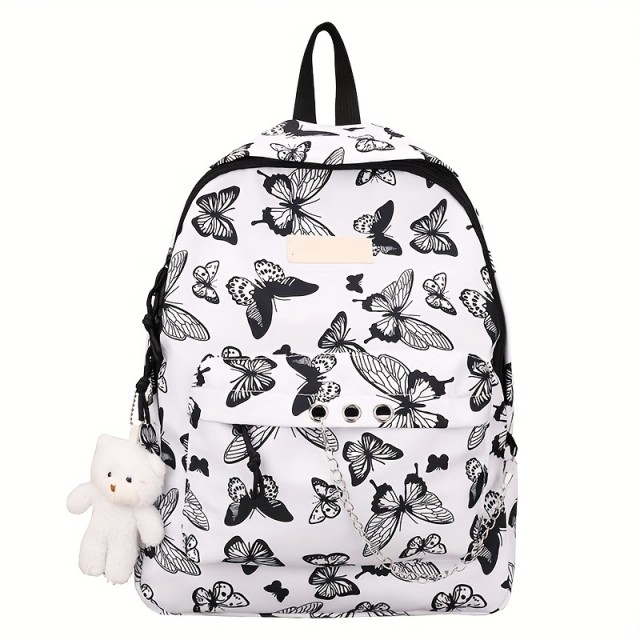 Prikupen črno-bel nahrbtnik z metulji in obeskom medvedka