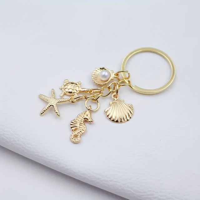 Zlat obesek za ključe z morskim motivom