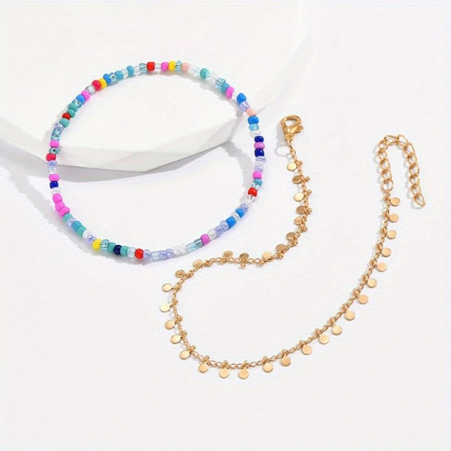 2 delni komplet zapestnic s pisanimi perlicami in okroglimi obeski