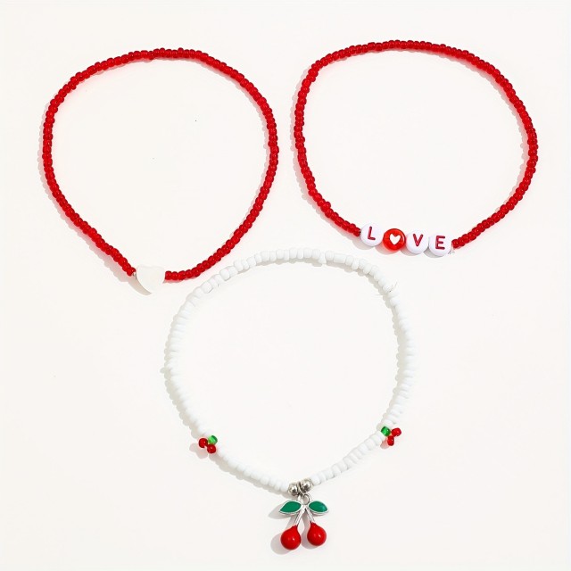 Komplet 3 zapestnic za nogo s češnjami in LOVE napisom