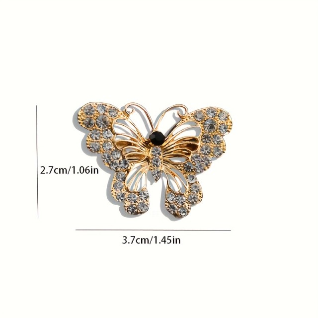 Elegantna črnozlata broška v obliki metulja