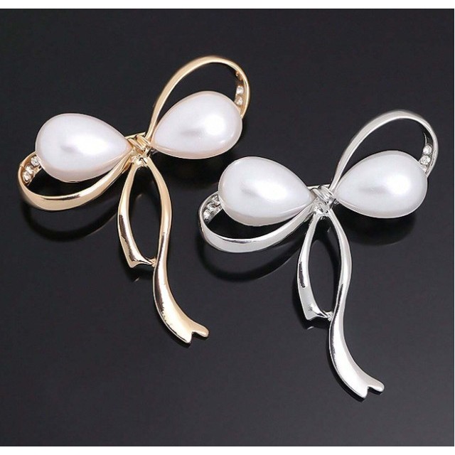 Elegantna broška zlate ali srebrne barve s pentljico