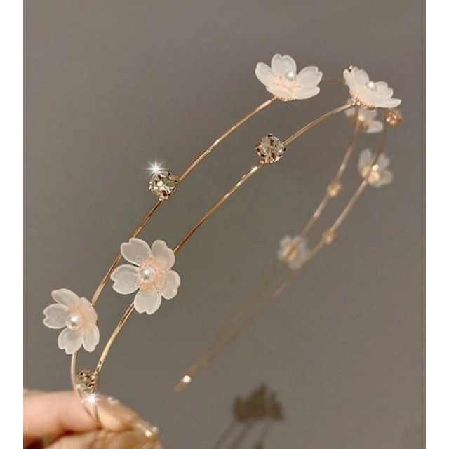 Prikupen kovinski obroč za lase z rožicami