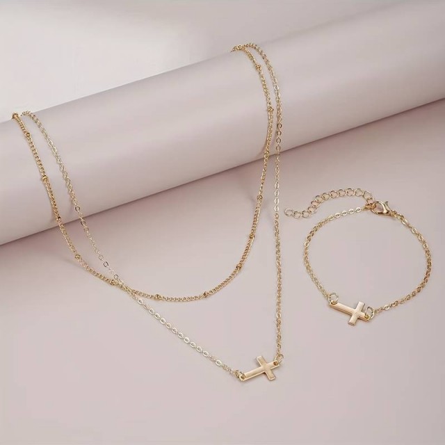 Zlat komplet z ogrlico in zapestnico s križem