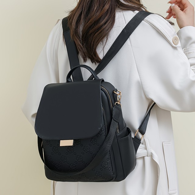 Elegantni črn ženski nahrbtnik s cvetličnimi detajli 