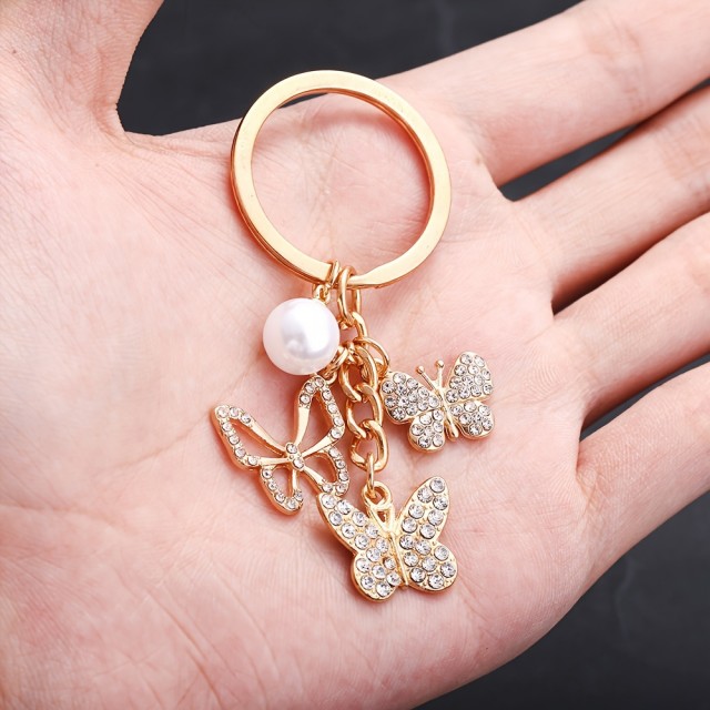 Obesek za ključe s 3 metuljčki zlate barve