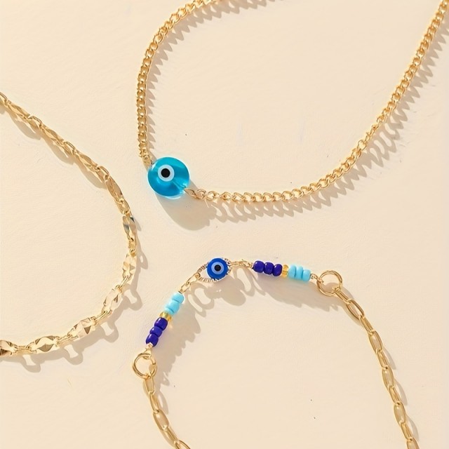 Komplet 3 zapestnic za nogo z modrim zaščitnim očesom in zlato verižico
