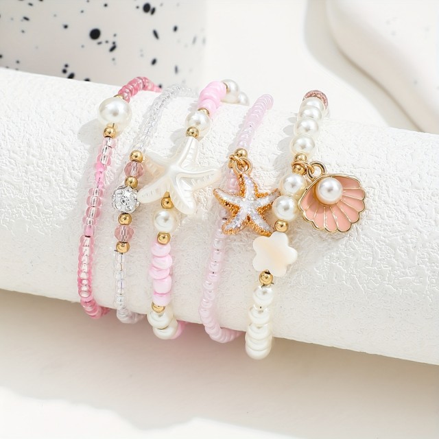 5 delni boho set zapestnic v roza barvi s školjkami