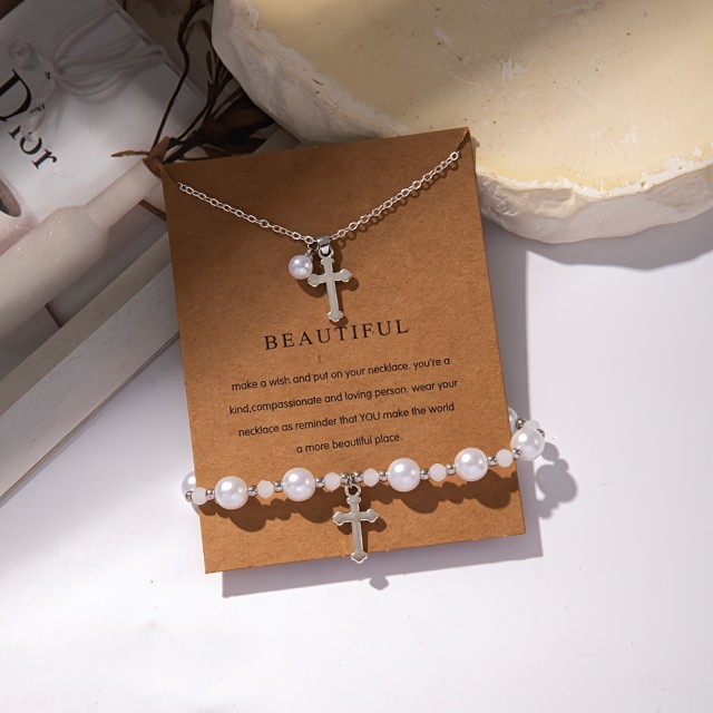 Komplet zapestnice in ogrlice s perlicami in križem