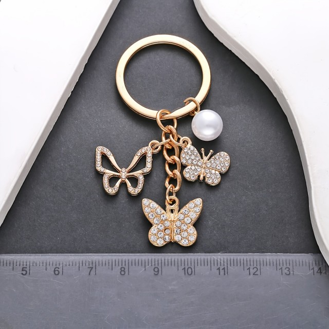 Obesek za ključe s 3 metuljčki zlate barve