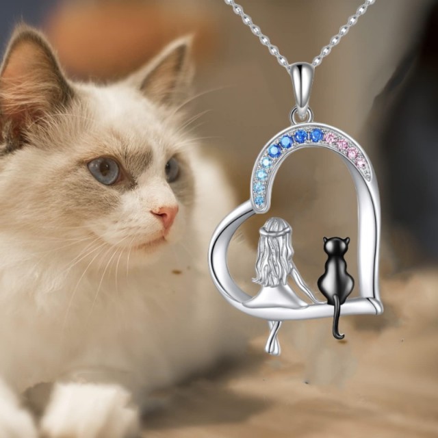 Ogrlica z obeskom deklice in mucka v srcu