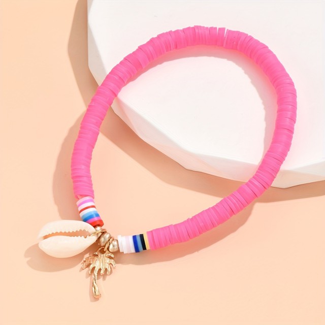 Pink zapestnica za nogo s školjkico in palmo