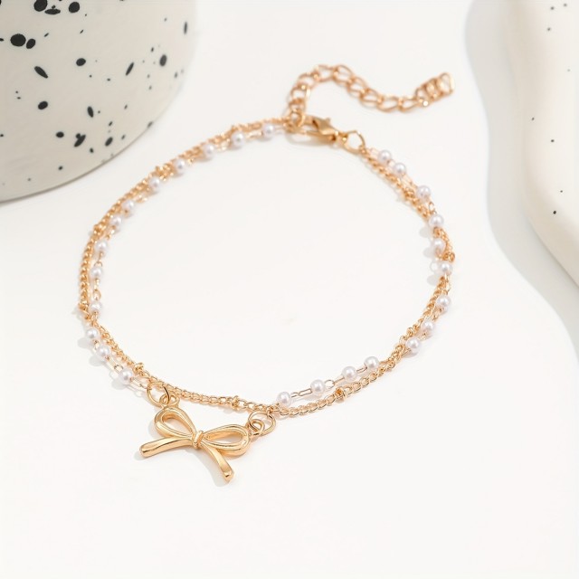 Dvodelni komplet zapestnice za nogo z zlato pentljo in perlicami