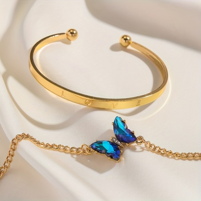 4 delni komplet zapestnic v zlatih odtenkih z modrimi dragulji 