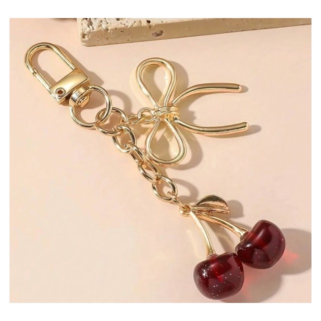 Zlat obesek za ključe s češnjico in pentljo 