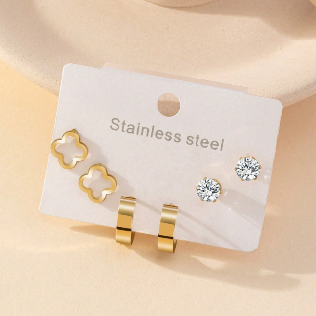 Set uhanov v zlati barvi s štiriperesno deteljico