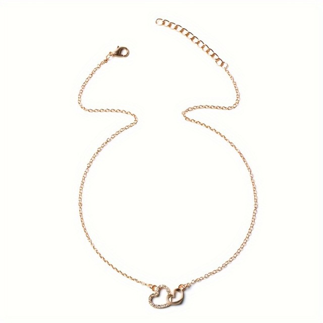 Elegantna ogrlica z dvojnim srcem v zlati barvi