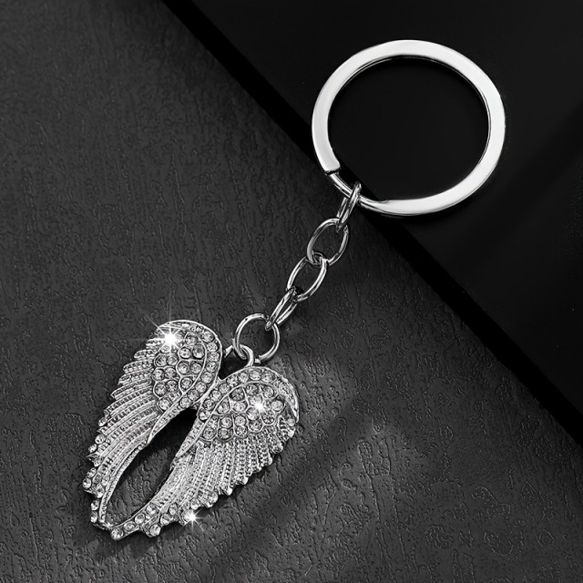 Obesek za ključe z bleščečimi krili