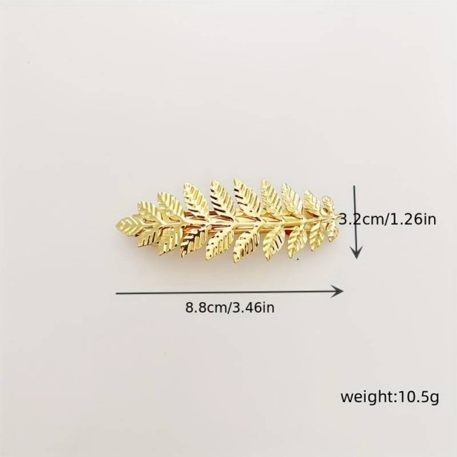 Špangica za lase zlate barve, vejica z listi