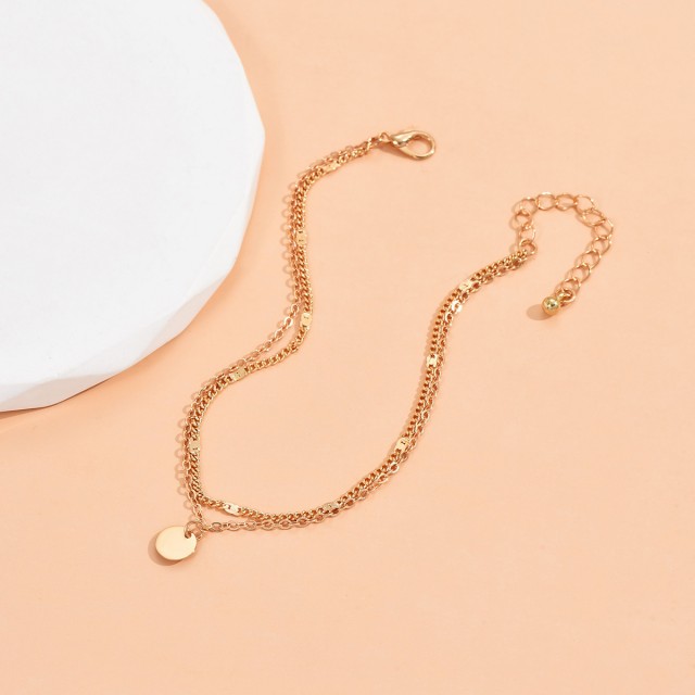 Dvojna zapestnica za nogo z obeskom krogca 2 barvi